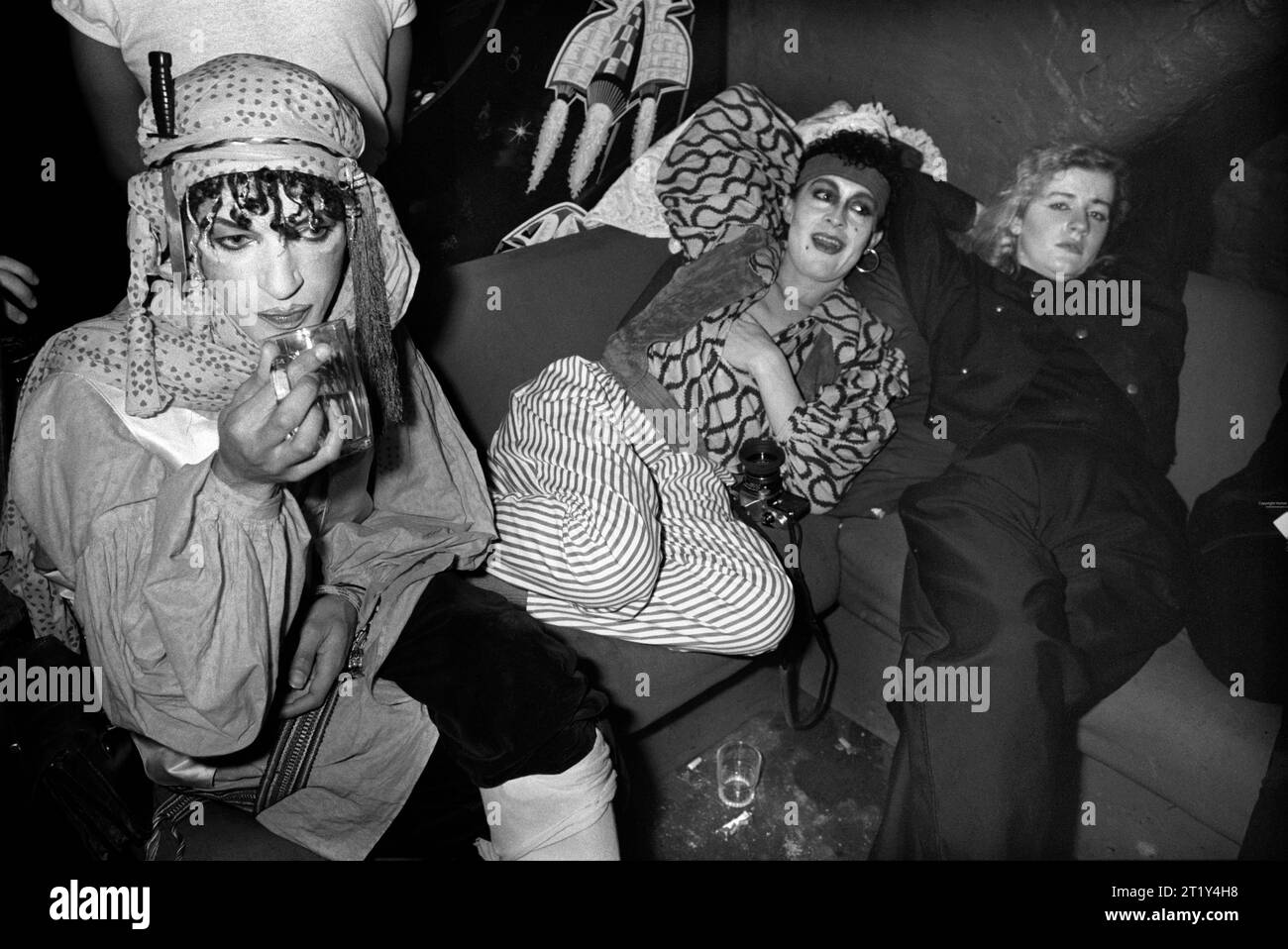 1980s UK New Romantics fashion youth movement, androgynous men and women getting dressed up at Heaven nightclub in Villiers Street Charing Cross, London, England December 1980 England  HOMER SYKES Stock Photo