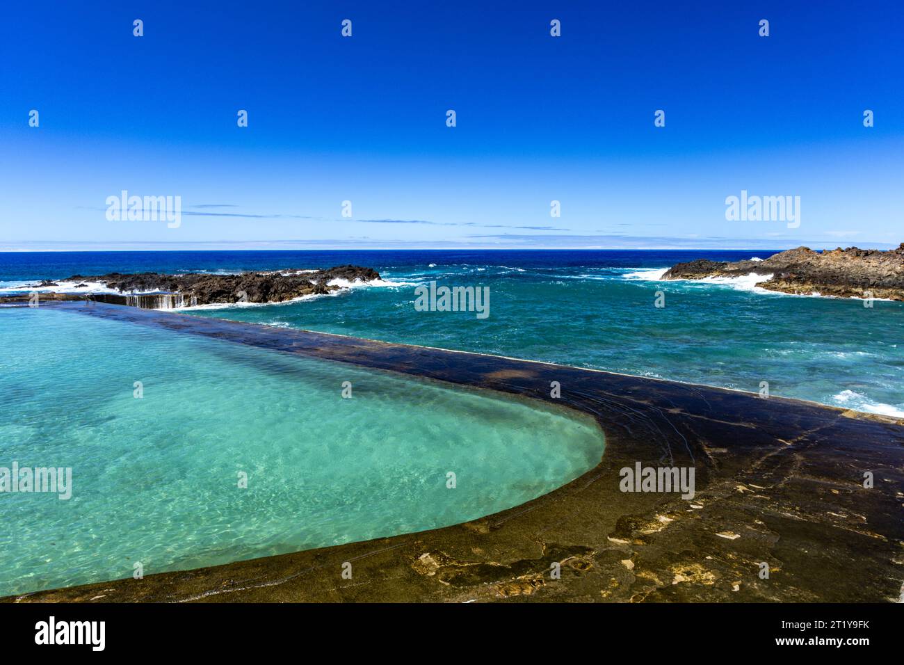 A natural swimming pool with water from the Atlantic Ocean, Piscina Natural Spain Tenerife Stock Photo