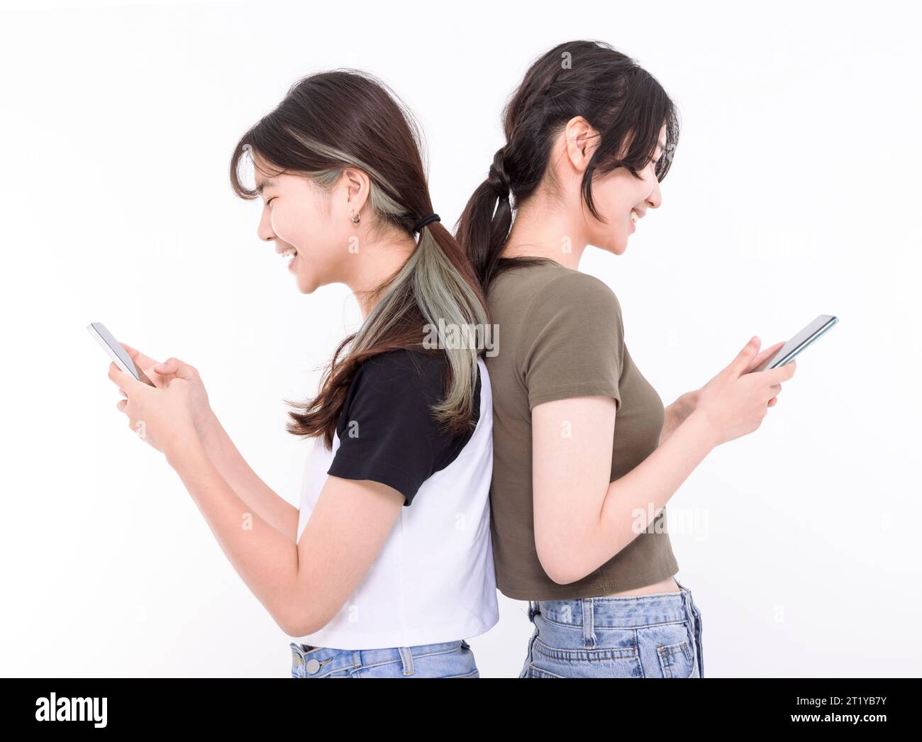 Two smart teenager student girls  watching the smart phone Stock Photo