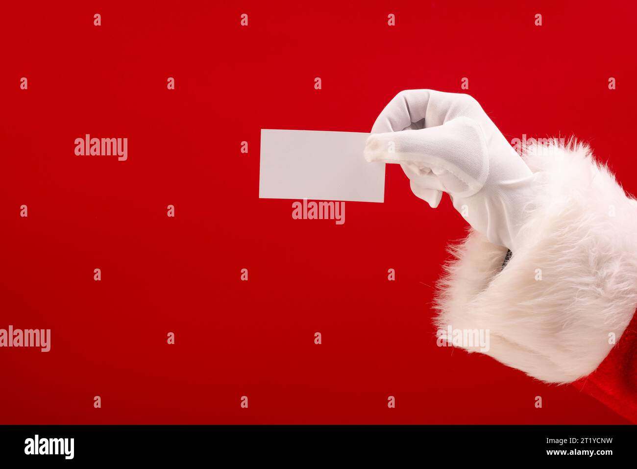 Santa claus holding white card with copy space on red background Stock ...