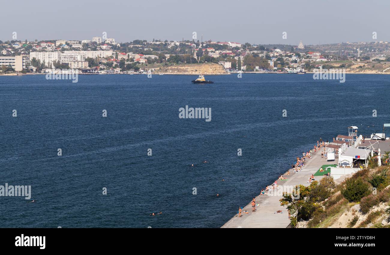 People rest at the beach. Khrustalny aerial view, a cape off the southern shore of the Sevastopol Bay of the Black Sea Stock Photo
