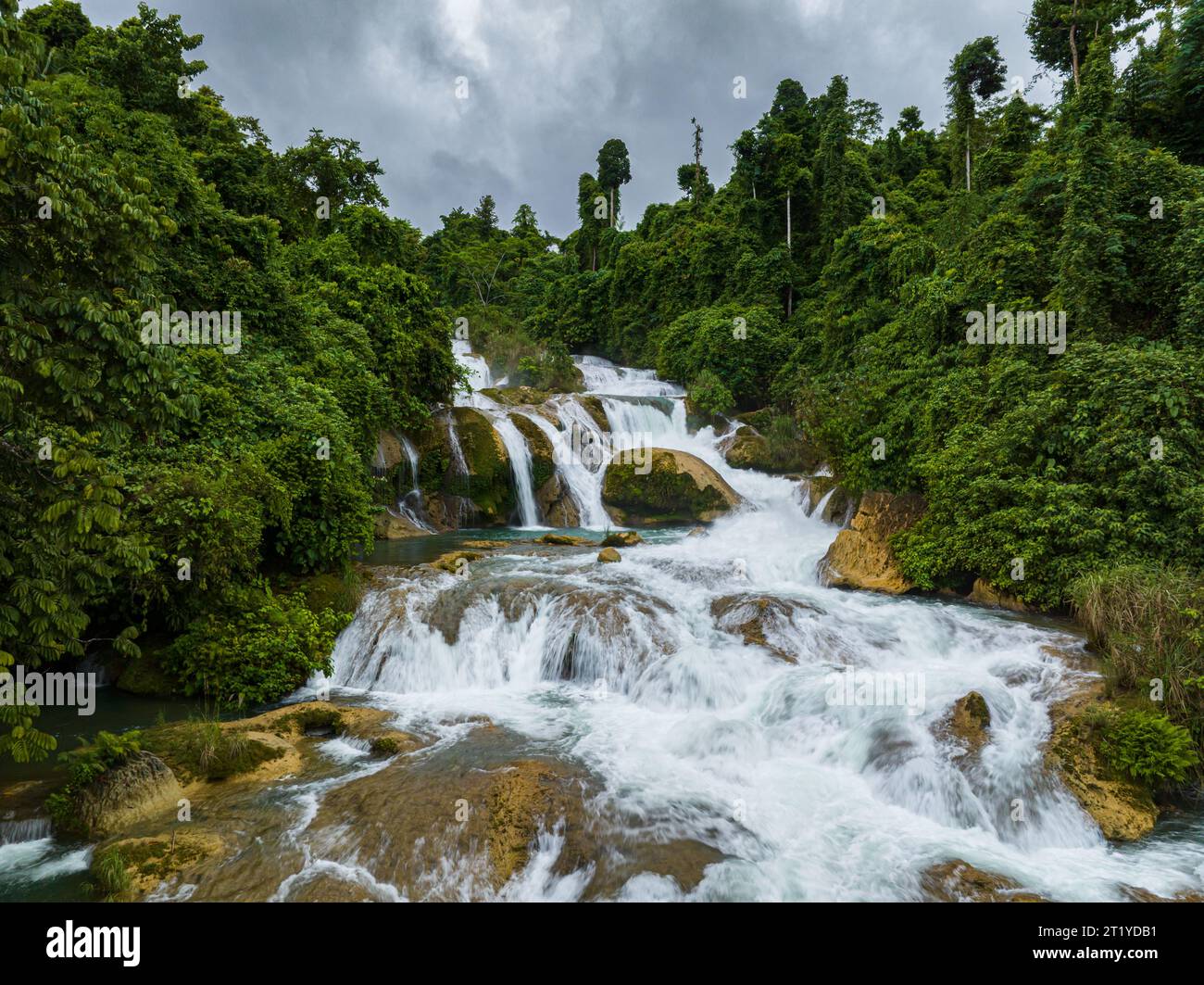 Drone view of Aliwagwag Falls surrounded by forest. Philippines. Cateel
