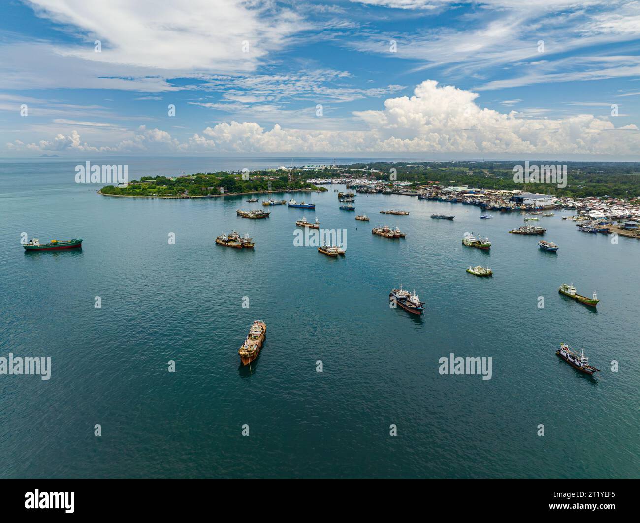 Cargo ships and fishing boats floating in seaport in Maasin, Zamboanga del Sur. Mindanao, Philippines. Stock Photo