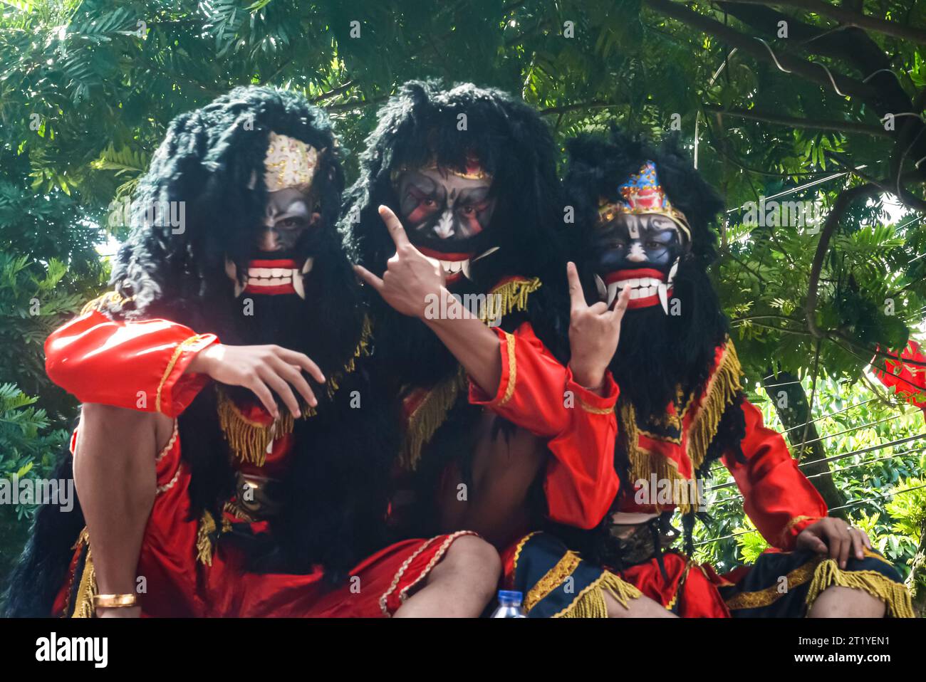 portrait of 3 men dressed up as giant, scary puppet characters with big