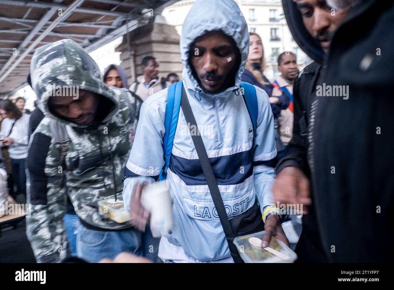 Paris, France. 15th Oct, 2023. Michael Bunel/Le Pictorium - Food distribution under the La Chapelle metro station - 15/10/2023 - France/France/Paris - Food distribution under the La Chapelle metro station organized by various associations and NGOs (Utopia 56, MDM, tendre la main, paris exil, la chorba, solidarite migrant wilson .). For the past week, a prefectoral decree has prohibited food aid for refugees, migrants and exiles in several streets in northern Paris. October 15, 2023. Paris, France. Credit: LE PICTORIUM/Alamy Live News Stock Photo