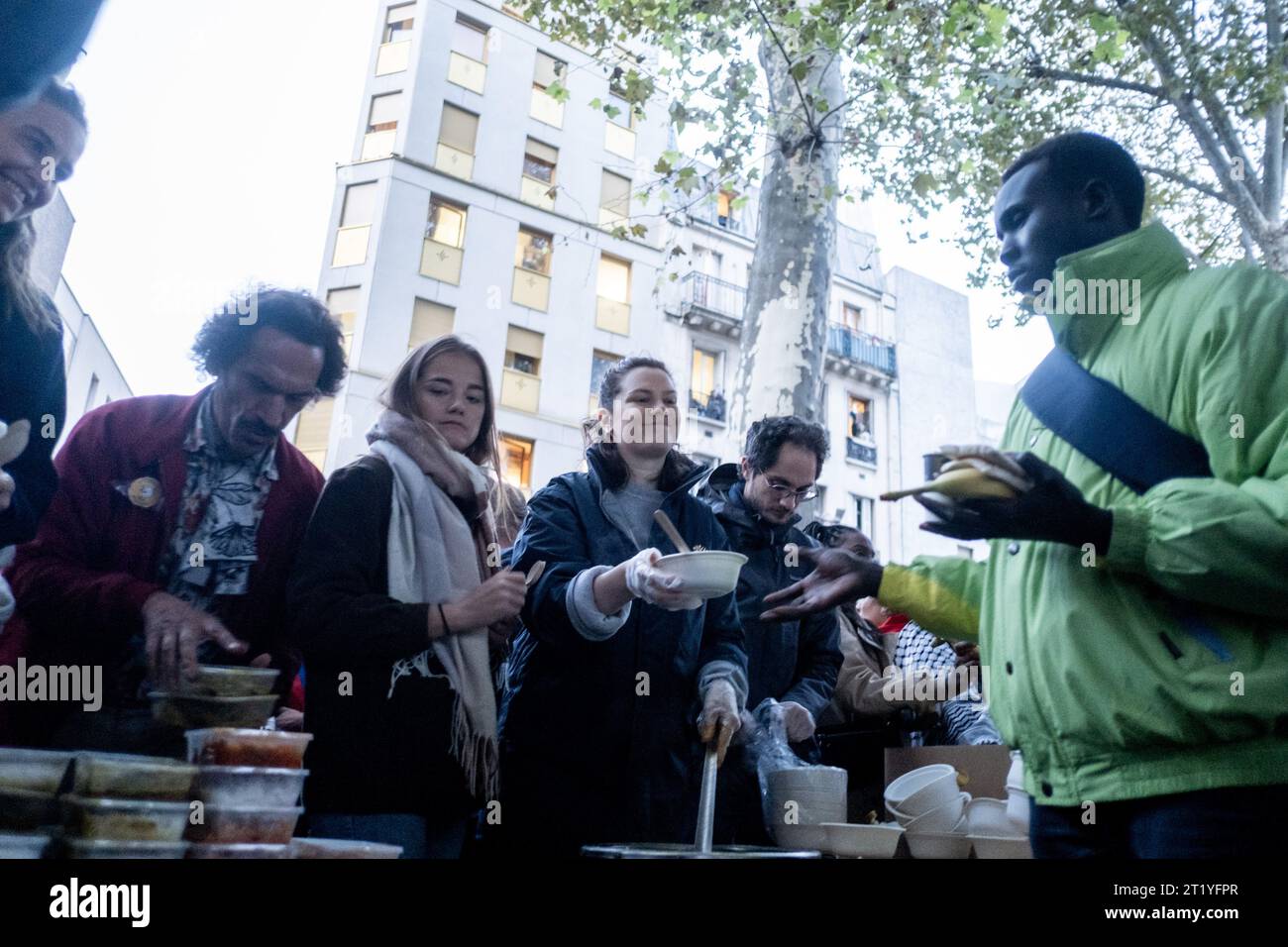 Paris, France. 15th Oct, 2023. Michael Bunel/Le Pictorium - Food distribution under the La Chapelle metro station - 15/10/2023 - France/France/Paris - Food distribution under the La Chapelle metro station organized by various associations and NGOs (Utopia 56, MDM, tendre la main, paris exil, la chorba, solidarite migrant wilson .). For the past week, a prefectoral decree has prohibited food aid for refugees, migrants and exiles in several streets in northern Paris. October 15, 2023. Paris, France. Credit: LE PICTORIUM/Alamy Live News Stock Photo