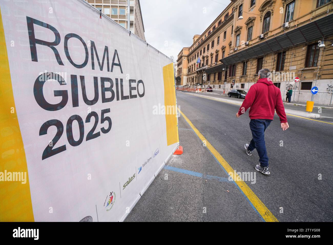 Rome, Italy 16 October 2023. A pedestrian walks past hoarding to mark