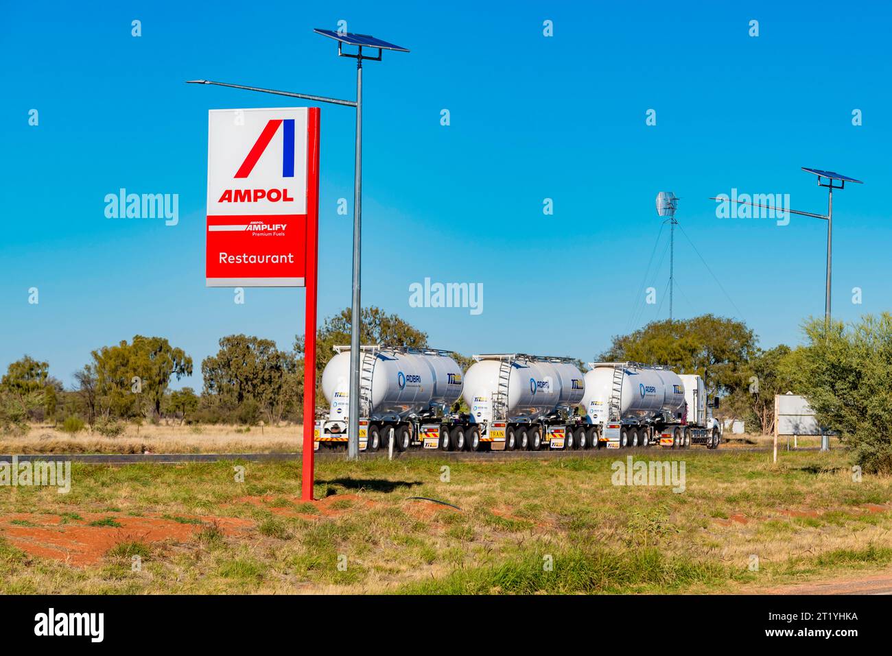 A Matic Transport road train carrying Adbri Masonry product on the Stuart Highway near Stuarts Well Roadhouse in Central Australia, Northern Territory Stock Photo