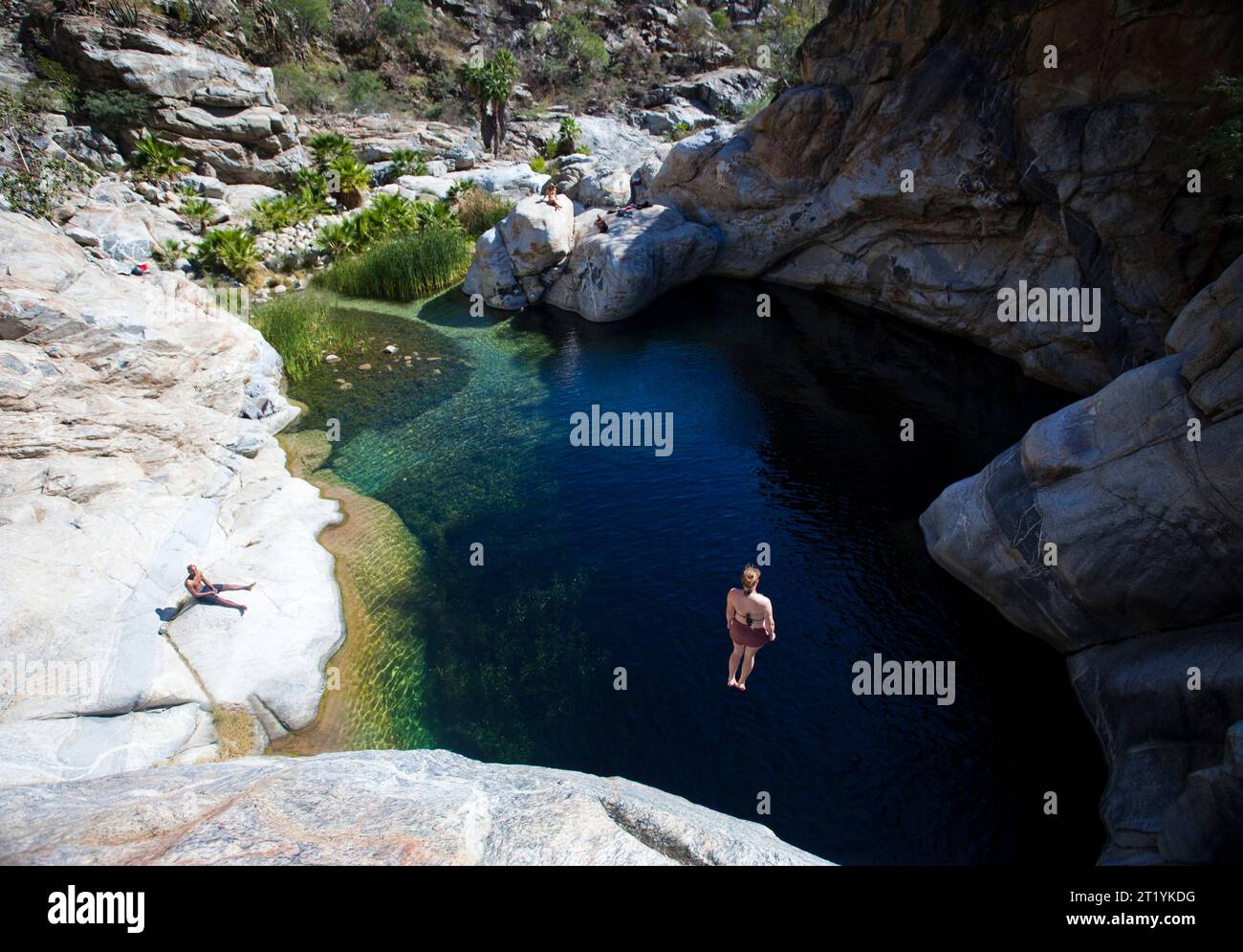 Woman jumps off cliff hi-res stock photography and images - Alamy