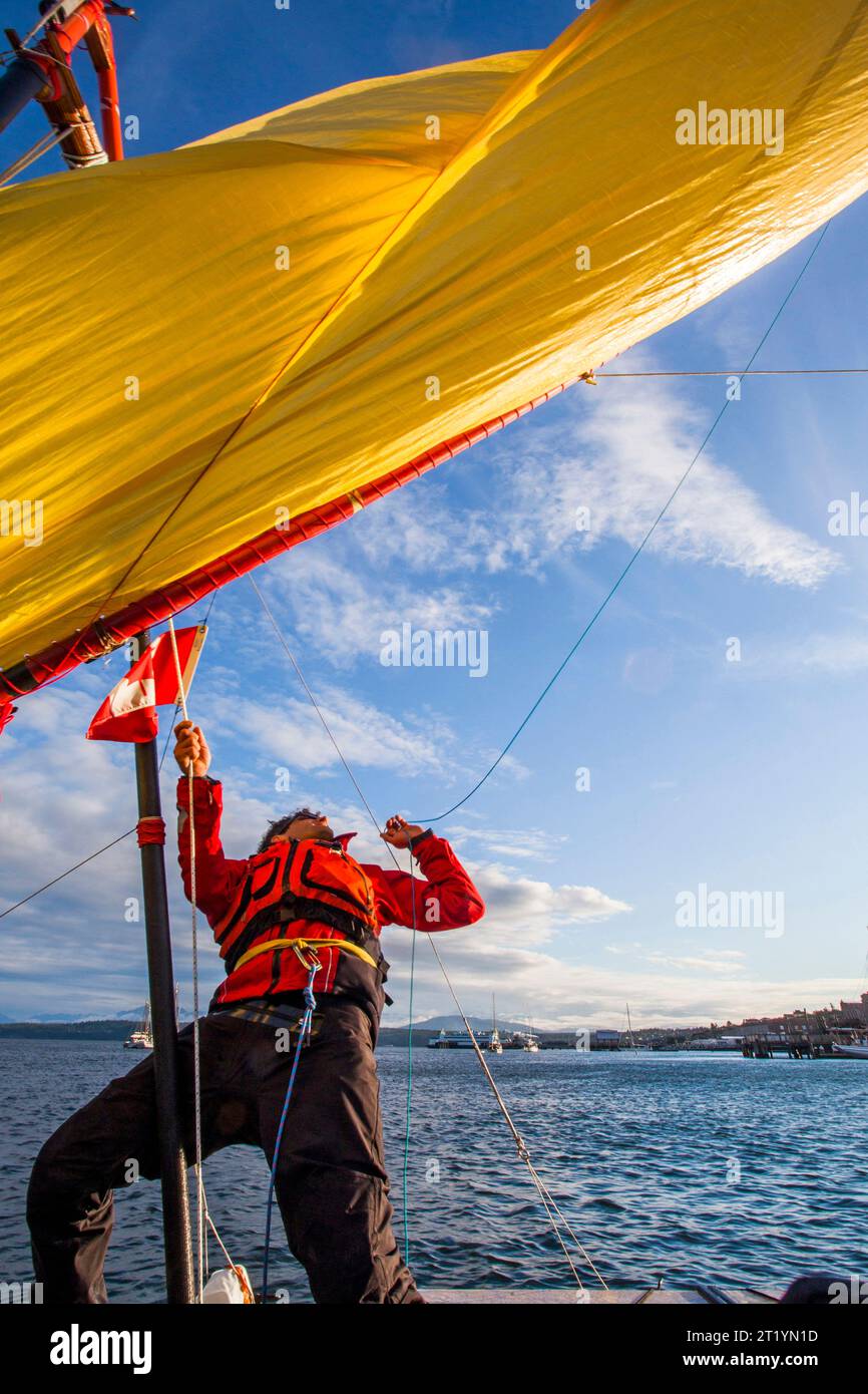A sailor on his boat before the start of the Race to Alaska, a 750 mile, non-motorized boat race from Port Townsend, WA to Ketchikan, Alaska. Stock Photo