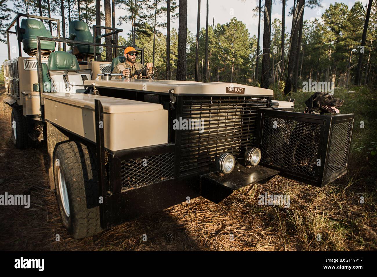 Hunter sitting in bird hunting vehicle, Bear Creek Reserve,