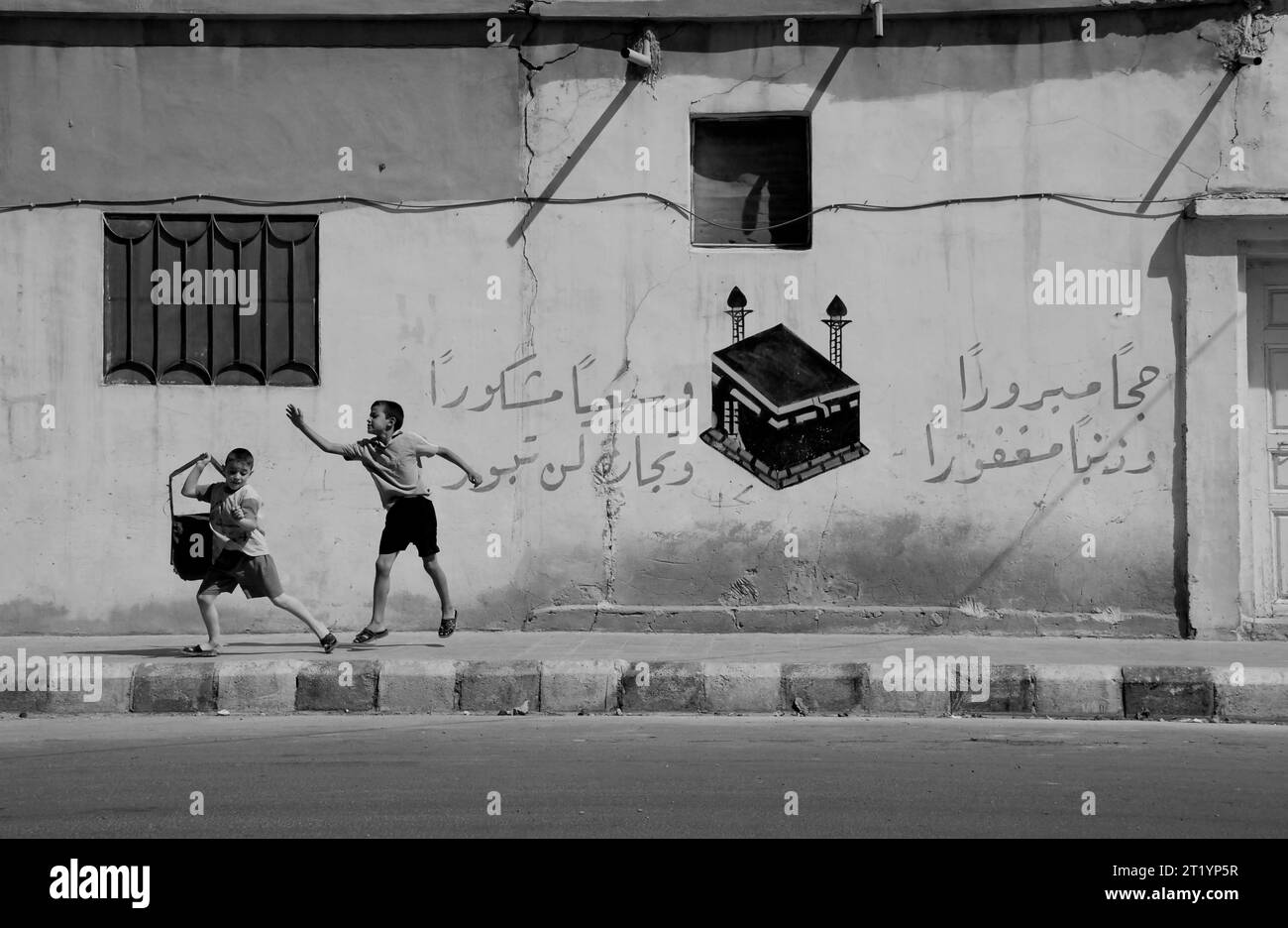 Young students playing in the streets of Palmyra, in Syria. Stock Photo