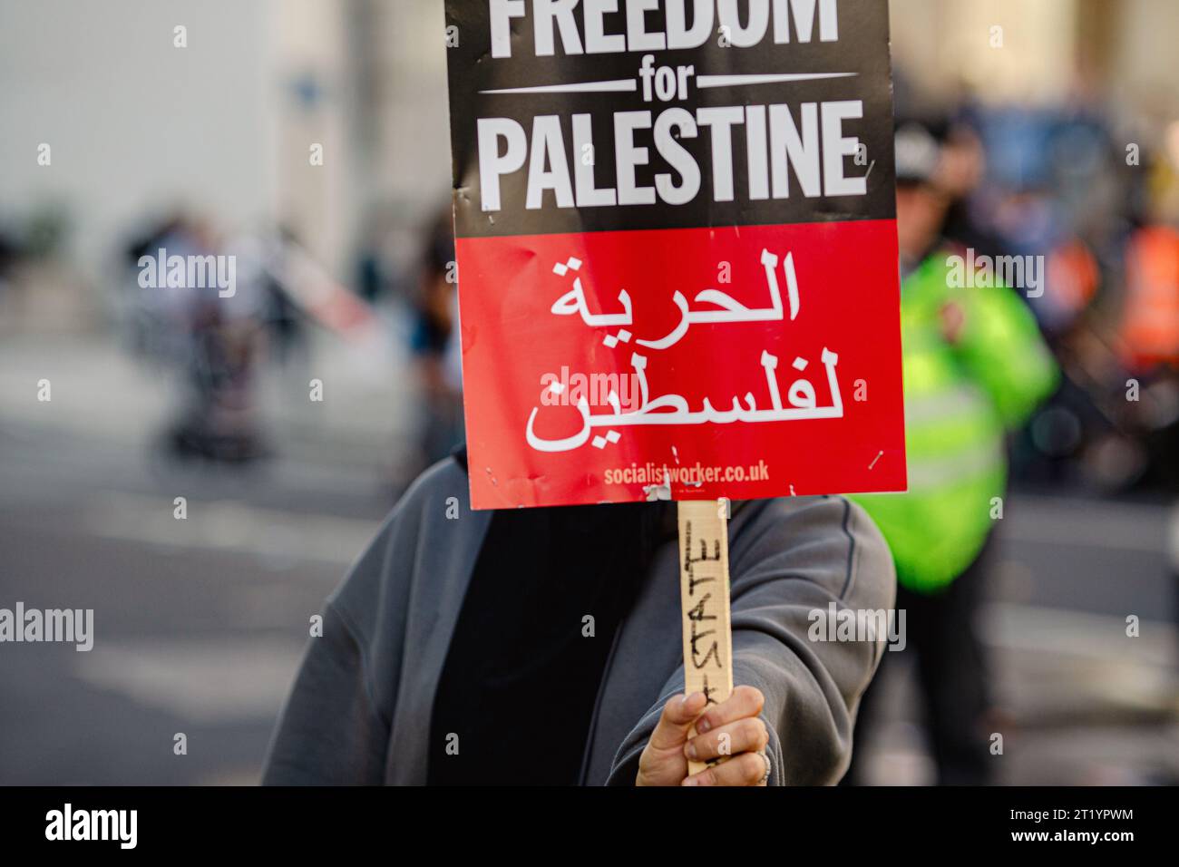 Unidentified person holding Free Palestine protest sign during the Pro-Palestine protest in London . Stock Photo