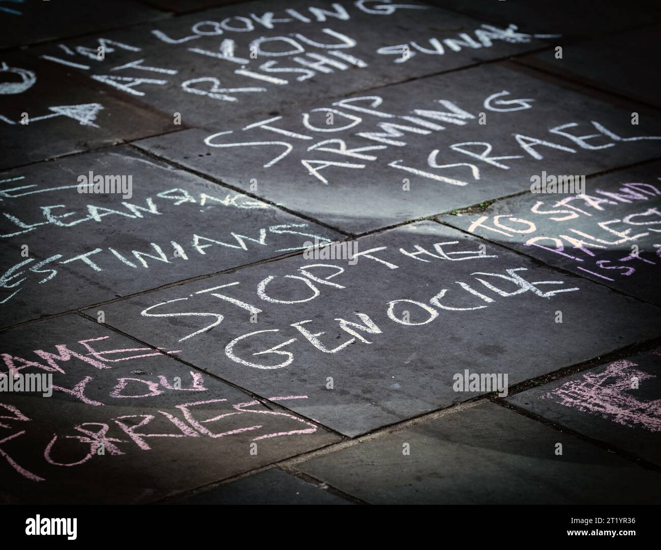 Protester painted  stop the genocide with chalk on the street during the Pro-Palestine protest in London . Stock Photo
