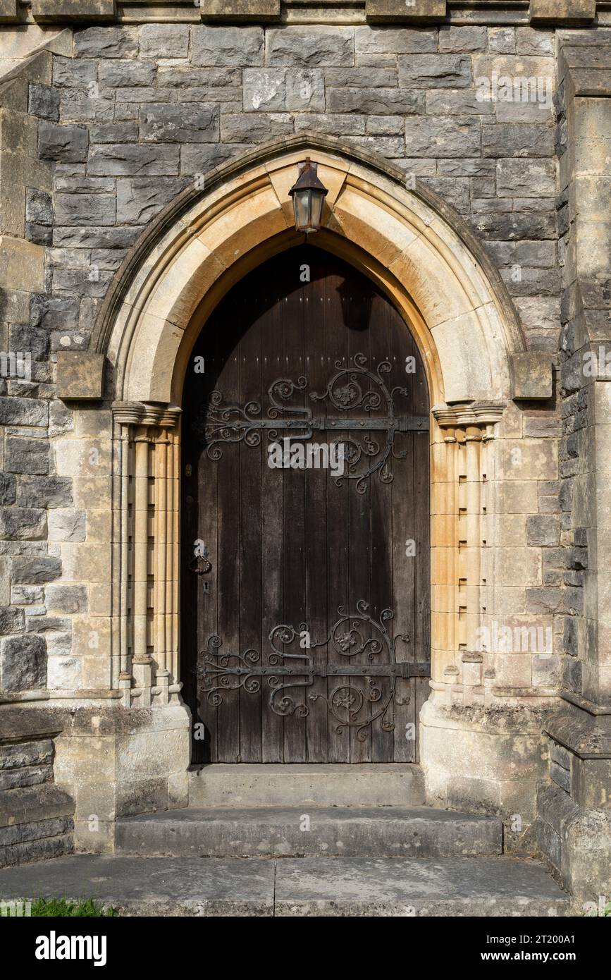 Highly detailed old wooden door at the side of an old English church. Brockenhurst October 2023. Stock Photo