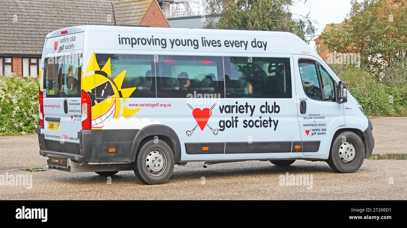 A UK Variety Club Golf Society donated sunshine minibus arriving in Hunstanton with disadvantaged youngsters day out at seaside resort Norfolk England Stock Photo