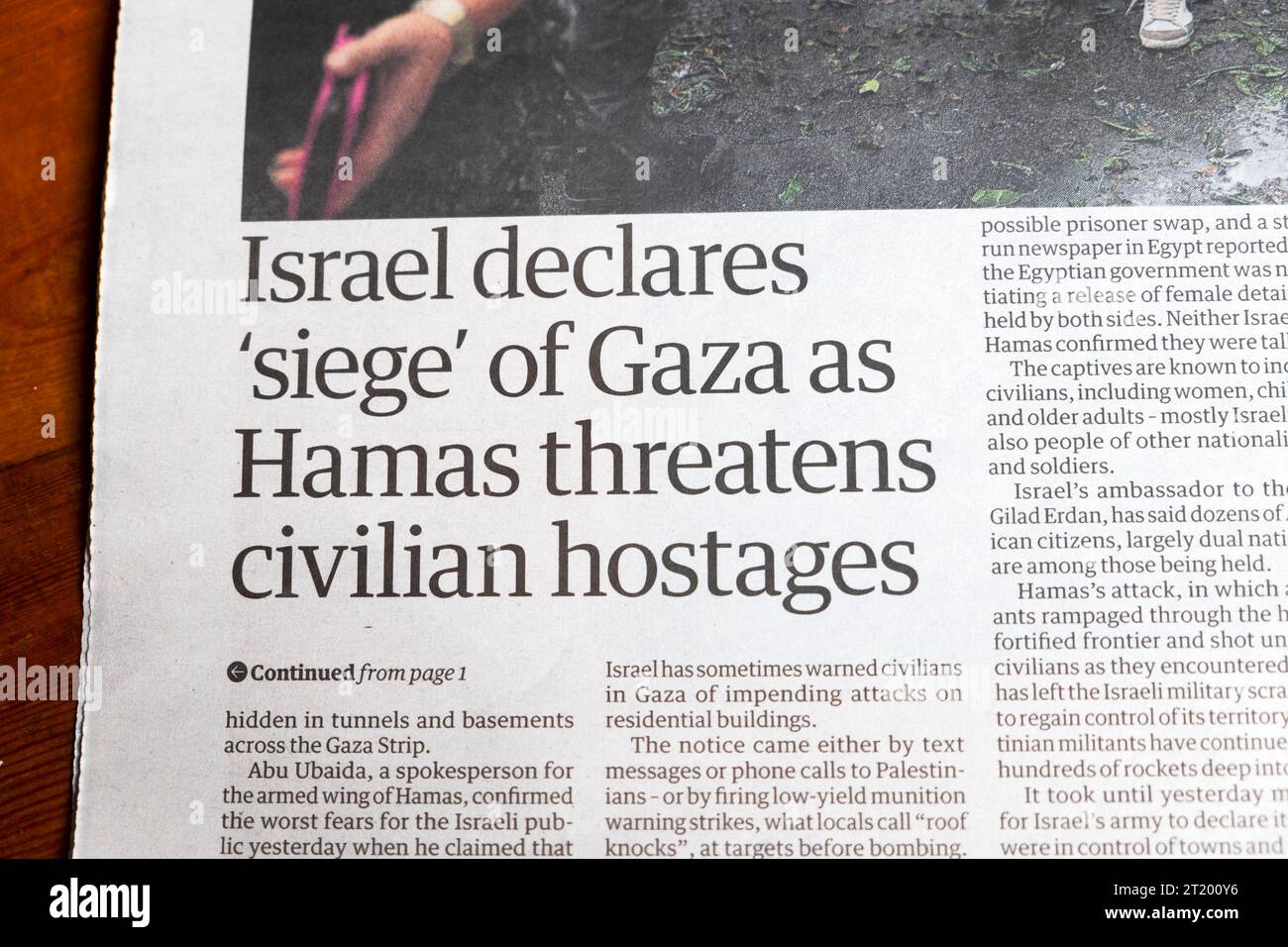 'Israel declares 'siege' of Gaza as Hamas threatens civilian hostages' Guardian newspaper headline Israeli Palestinian war 10 October 2023 London UK Stock Photo