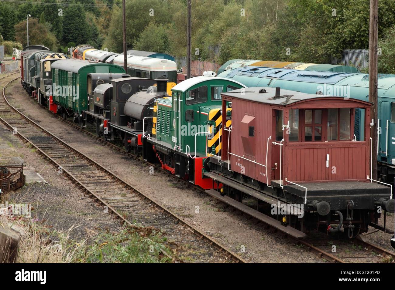 Preserved steam and diesel shunting locomotives and rolling stock stabled at Barrow Hill Roundhouse, UK. Stock Photo