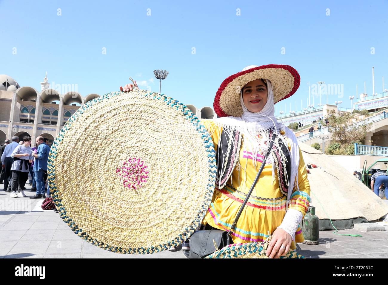 Tehran, Iran. 10th Oct, 2023. A woman shows a product during a