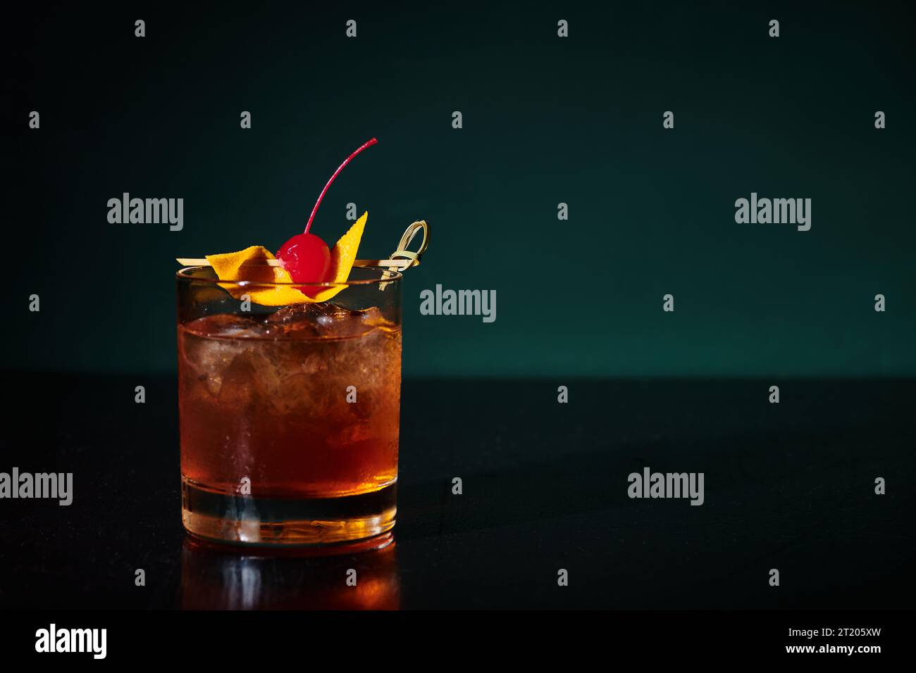 thirst quenching esthetic negroni with cherry full of ice on black