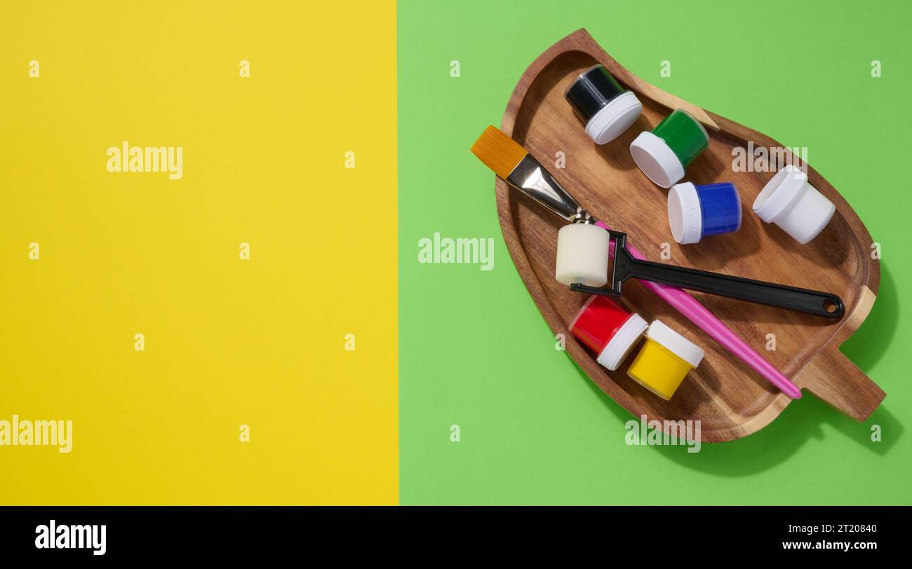 Plastic jars with multi-colored gouache, copy space Stock Photo