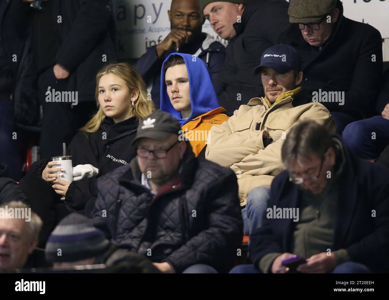 David Beckham, Cruz Beckham & Tana Holding. - Brentford B v Arsenal U21, Premier League Cup, Quarter final, VBS Community Stadium, Sutton, UK - 13th March 2023. Editorial Use Only - DataCo restrictions apply, Editorial Use Only. Stock Photo