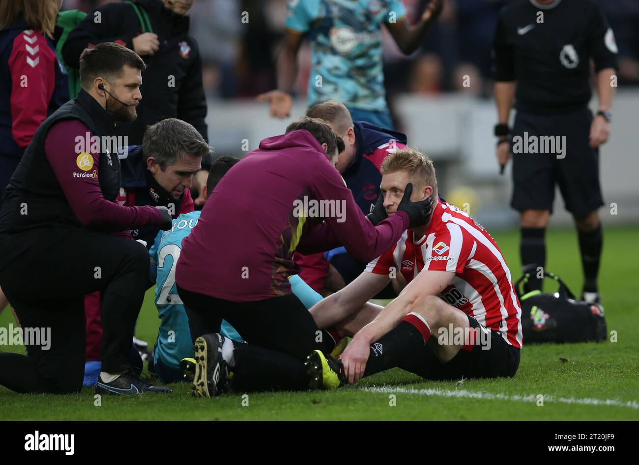 Ben Mee of Brentford receives treatment for a heads injury after scoring. Brentford v