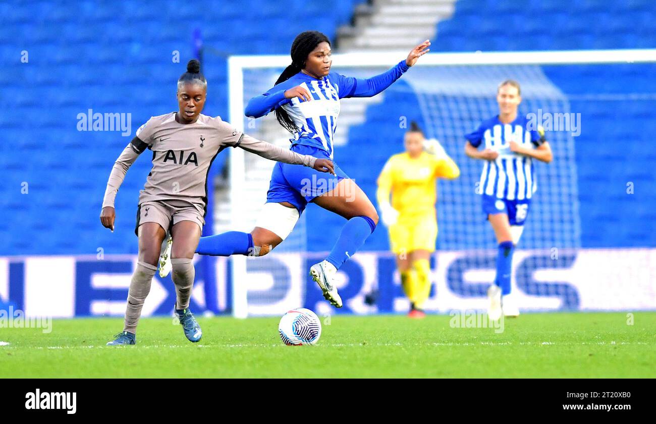 Brighton UK 15th October 2023 -  Madison Haley (r)  of Brighton leaps into action during the Barclays  Women's Super League football match between Brighton & Hove Albion and Tottenham Hotspur at The American Express Stadium (Editorial Use Only) : Credit Simon Dack /TPI/ Alamy Live News Stock Photo