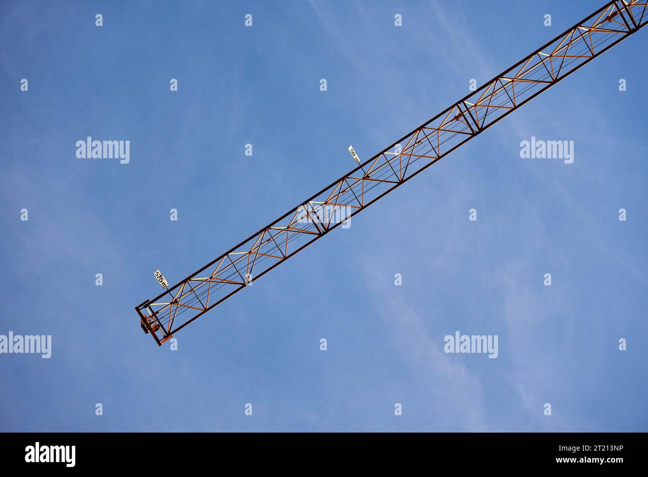 A low angle of a construction crane against the blue sky Stock Photo ...
