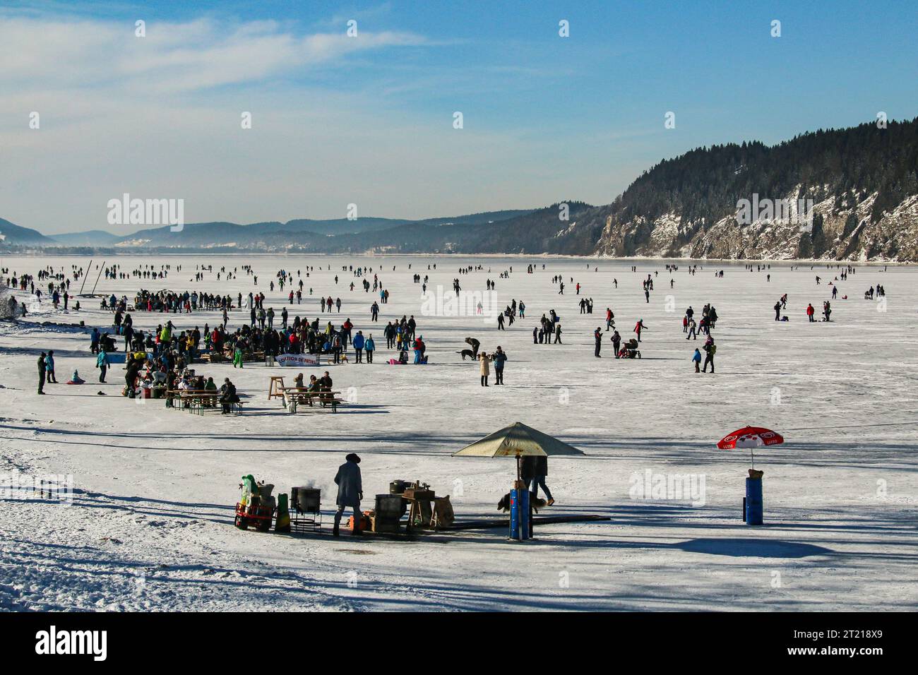 Winter hobbies on frozen Joux lake in swiss jura mountain Stock Photo