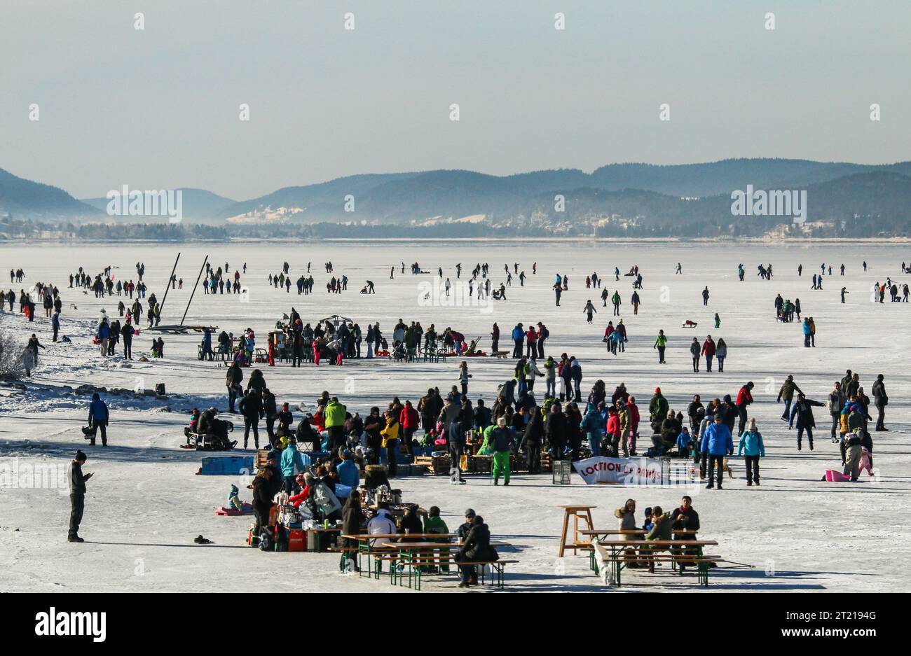 Winter sports on frozen Joux lake in swiss jura mountain Stock Photo