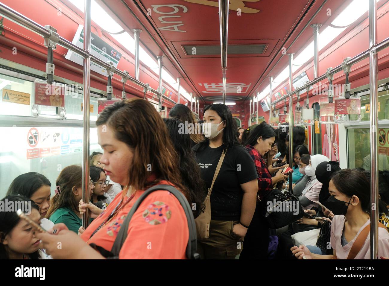 Manila, Philippines: Filipino commuters inside the female cabin in an ...