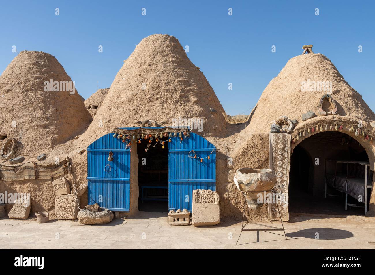 A beehive or tomb house is a building made from a circle of stones and mud topped with a domed roof. The name comes from the similarity in shape to a Stock Photo