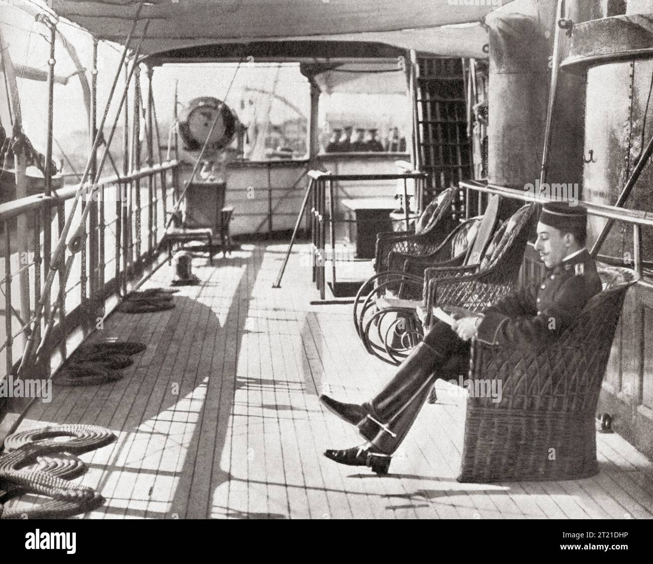 King Alfonso XIII seen here reading a letter whilst on board the Giralda, during his journey from Santander to San Sebastian in 1912. Alfonso XIII, 1886 –  1941, aka El Africano or the African. King of Spain. From Mundo Grafico, published 1912. Stock Photo