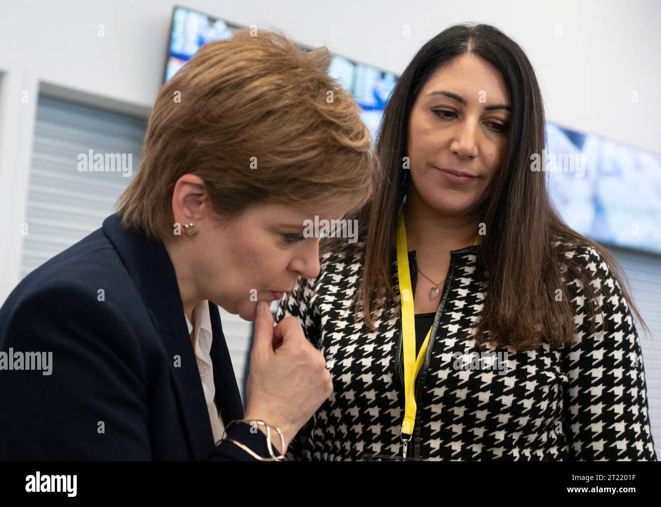 Aberdeen, Scotland, UK. 16th October 2023.  Day two of the SNP annual conference and former First Minister Nicola Sturgeon makes an appearance. A media frenzy followed before she made her way into the conference venue to listen to the afternoon’s proceedings.  Nicola Sturgeon has quiet words with wife of Humza Yousaf Nadia El-Nakla. Iain Masterton/Alamy Live News Stock Photo
