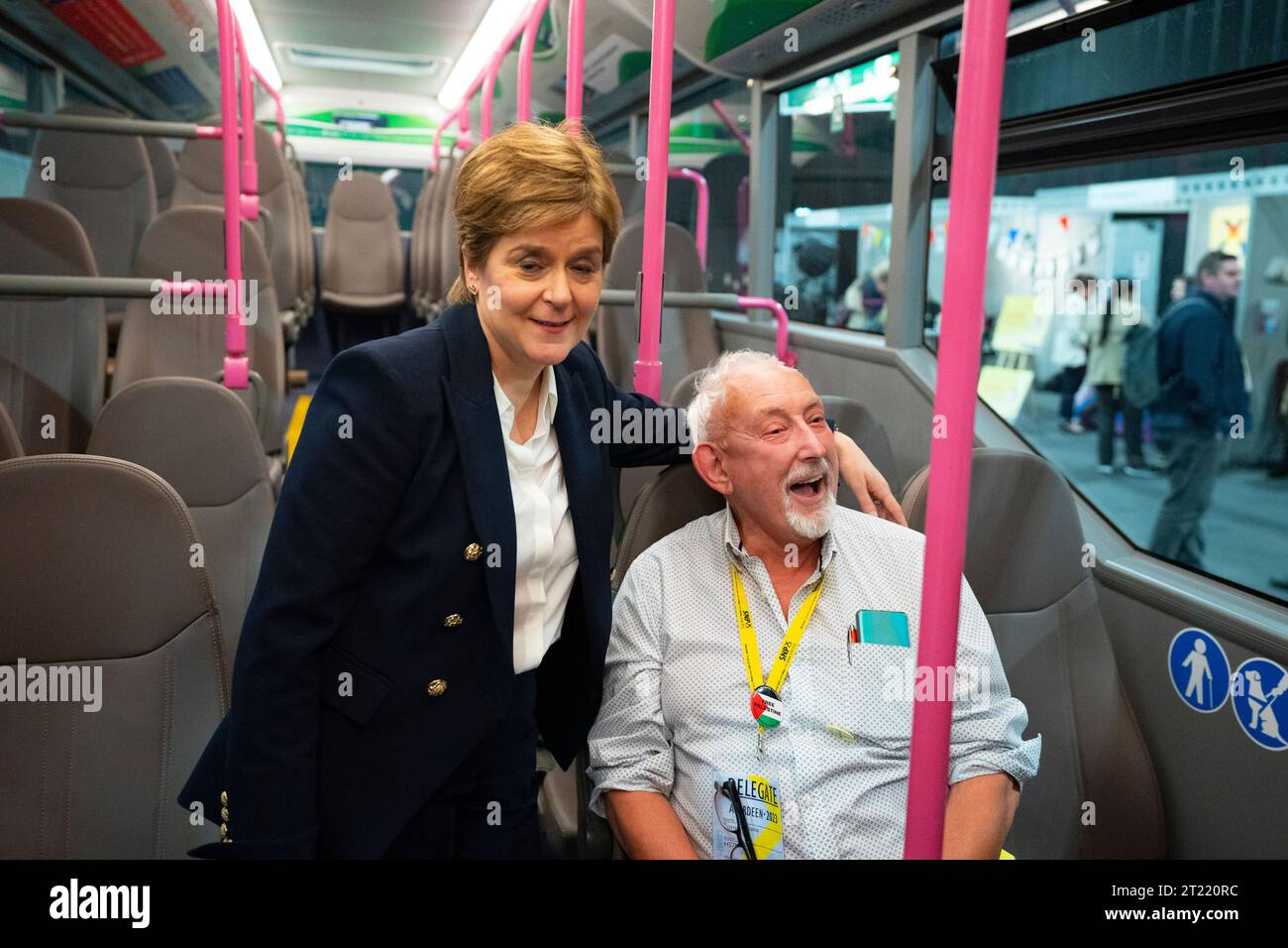 Aberdeen, Scotland, UK. 16th October 2023.  Day two of the SNP annual conference and former First Minister Nicola Sturgeon makes an appearance. A media frenzy followed before she made her way into the conference venue to listen to the afternoon’s proceedings. Nicola Sturgeon meets team members from First Bus on a new electric bus. Iain Masterton/Alamy Live News Stock Photo