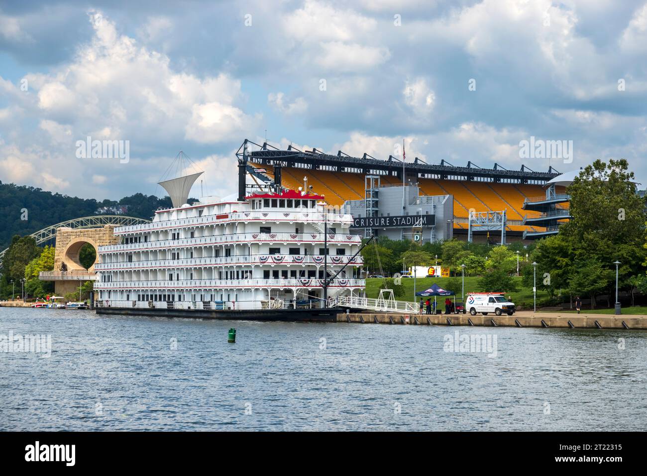 American Heritage, a sternwheeler cruise ship, docked in Pittsburgh beside Acrisure Stadium, formerly and colloquially known as Heinz Field Stock Photo
