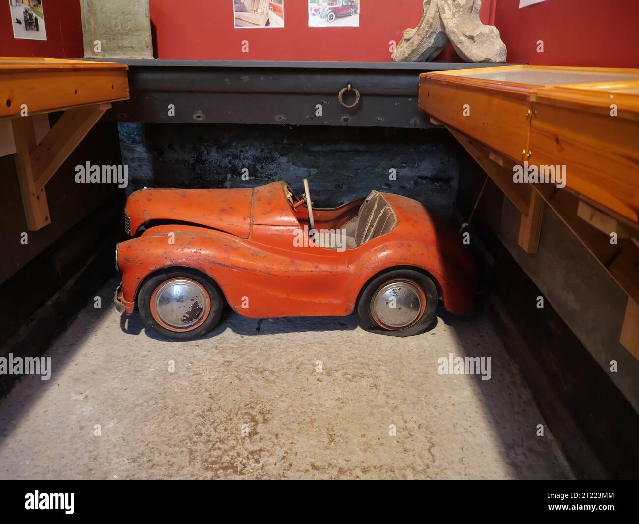 An old tin toy car in Prideaux Place, Padstow, Cornwall, England Stock