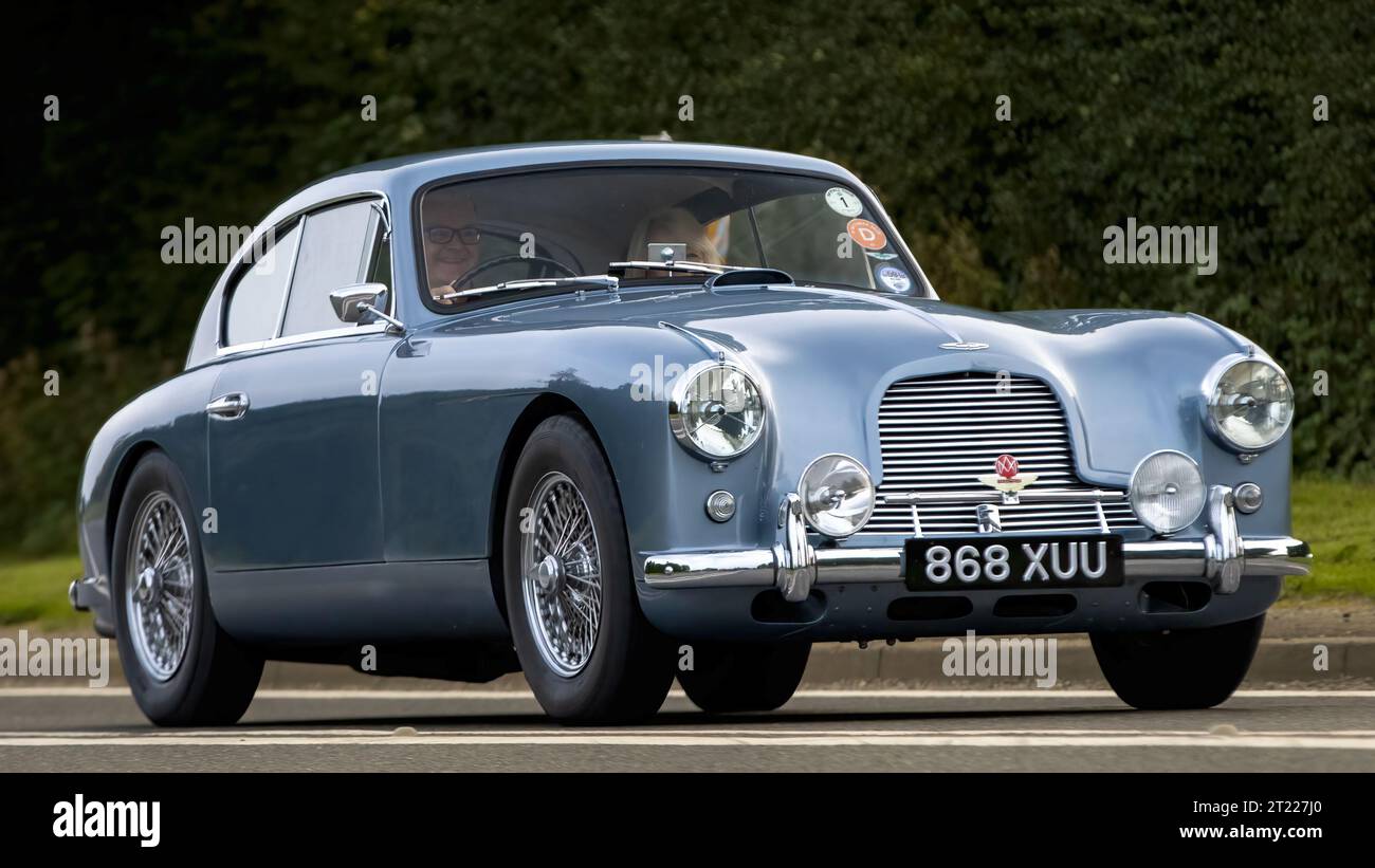 Bicester,Oxon.,UK - Oct 8th 2023: 1954 blue Aston Martin DB2 4  classic car driving on an English country road. Stock Photo