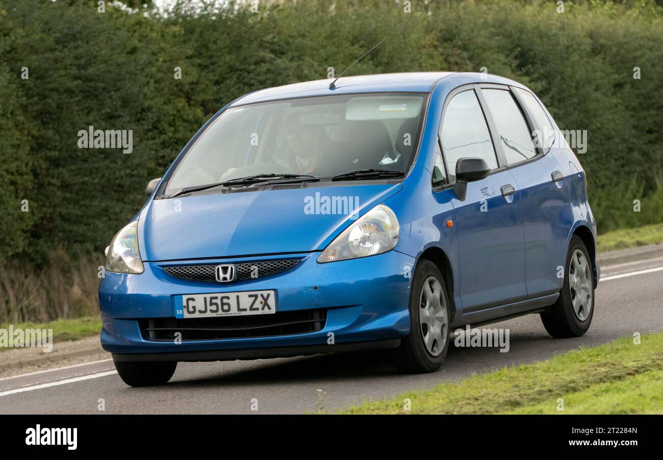 Bicester,Oxon.,UK - Oct 8th 2023: 2006 blue Honda Jazz  classic car driving on an English country road. Stock Photo