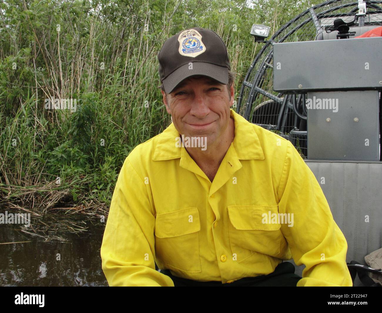 Mike Rowe, the popular host of the Discovery Channel series 'Dirty Jobs with Mike Rowe,' donned a U.S. Fish and Wildlife Service cap when he waded into Arthur R. Marshall National Wildlife Refuge in April 2010. Subjects: Connecting people with nature; Work of the Service. Location: Florida. Fish and Wildlife Service Site: ARTHUR R. MARSHALL LOXAHATCHEE NATIONAL WILDLIFE REFUGE. Stock Photo