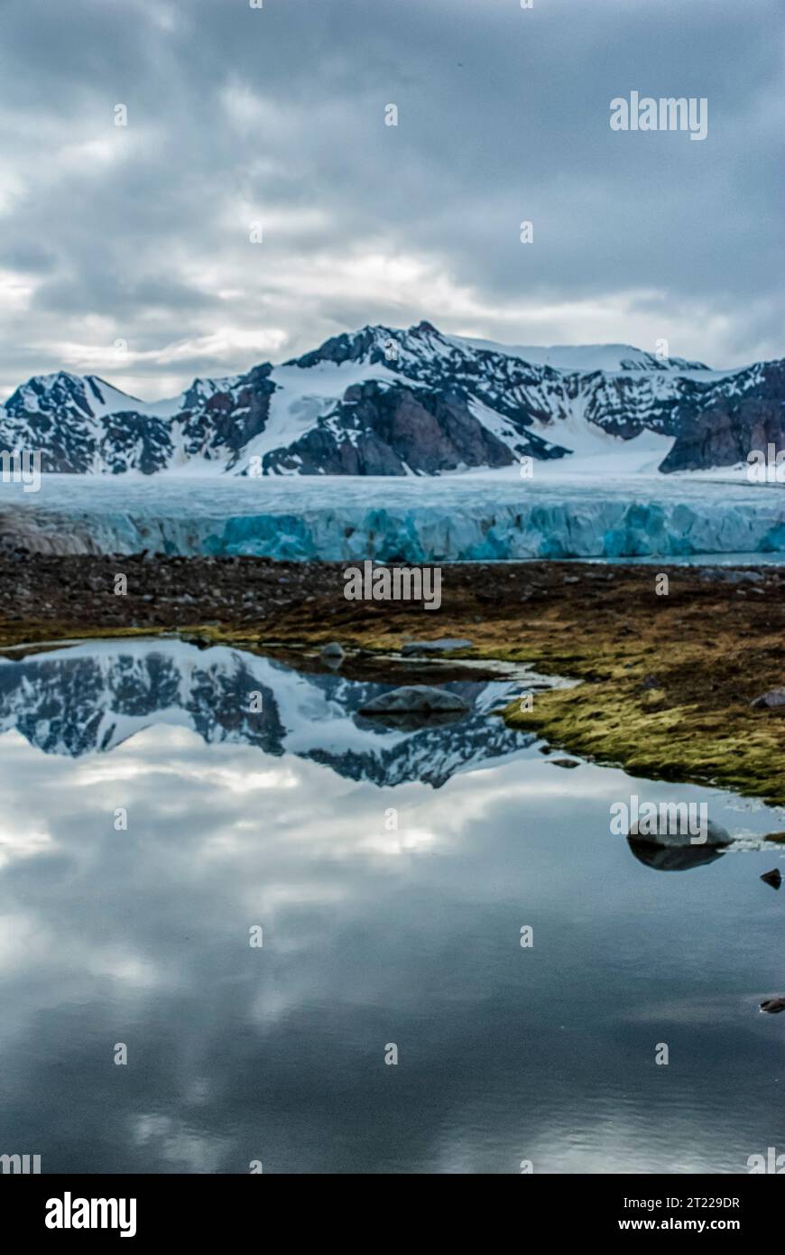 Fjortende Julibreen, 14th July Glacier and reflection, Svalbard, Norway Stock Photo