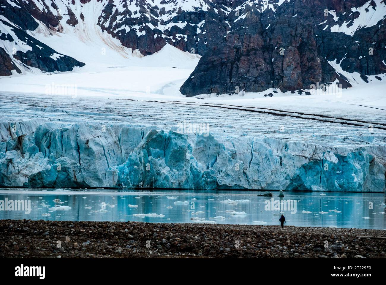 Person observing  Fjortende Julibreen, 14th July Glacier, Svalbard, Norway Stock Photo