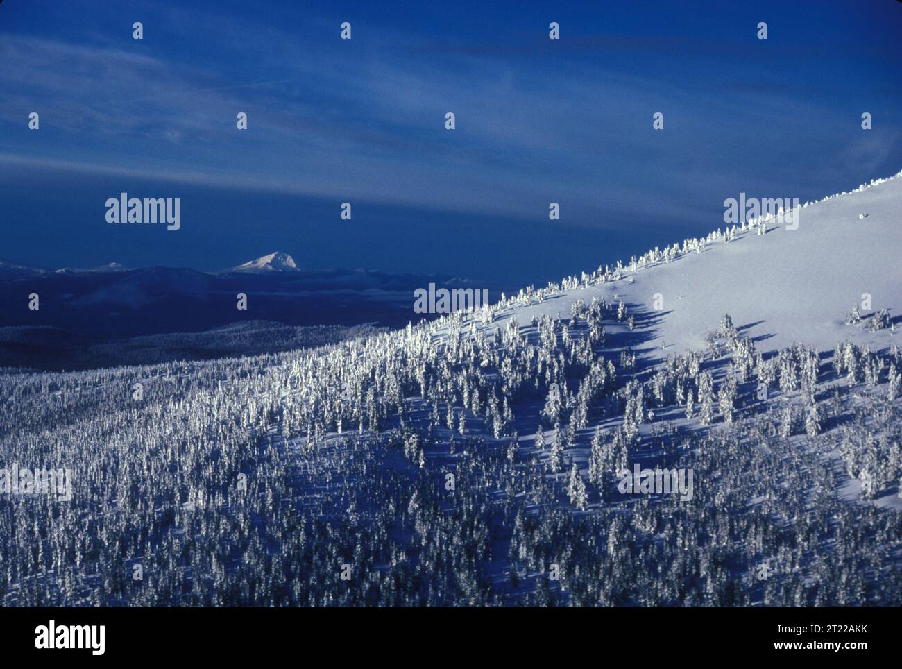 View of Cascade Range in winter from Mt. Scott looking southwest to Mt. McLoughlin. Subjects: Mountains; Scenics; Snow. Location: Oregon.  . 1998 - 2011. Stock Photo