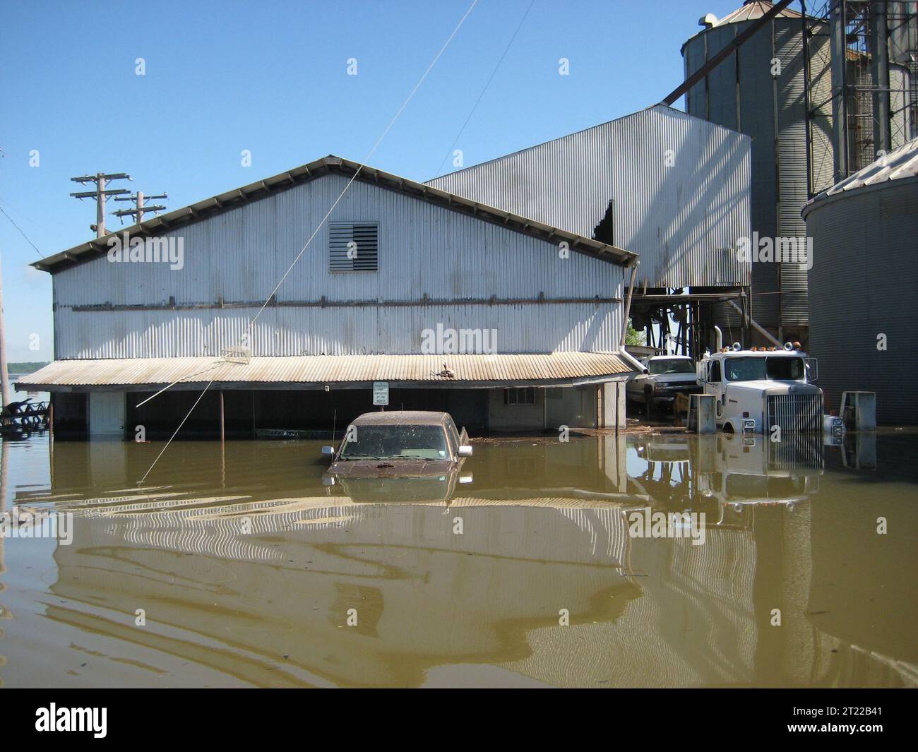 Waters Swamped Trucks and Other Farming Equipment at the Farming Co-Op on Bald Knob National Wildlife Refuge. Subjects: Floods; Natural disasters; Wildlife refuges; Roads; Vehicles; Buildings, facilities and structures. Location: Arkansas. Fish and Wildlife Service Site: BALD KNOB NATIONAL WILDLIFE REFUGE. Stock Photo