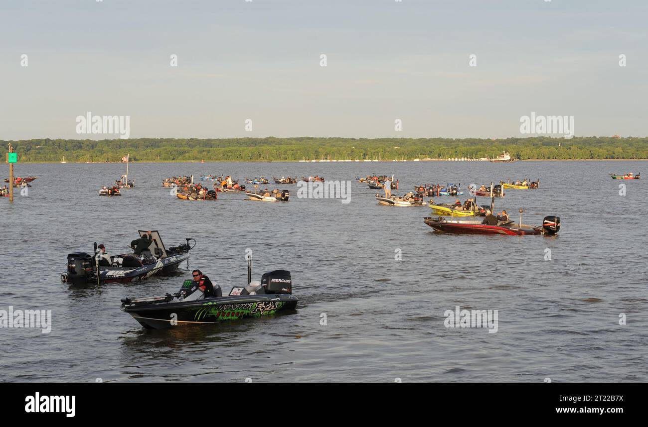 A picture of speedboats carrying participants of the 2011 National River Bass Tournament. Subjects: Fishes; Fishing; Events; Boats; Recreation; Children. Location: Maryland. Stock Photo