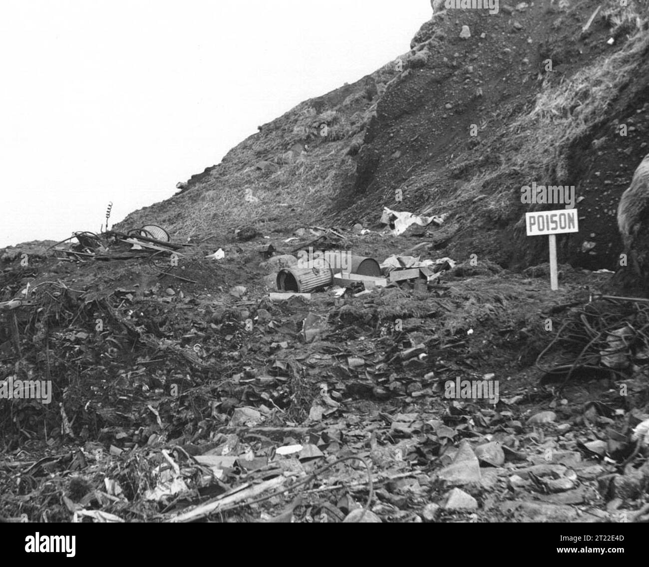 Consolidated Army, Navy, Air Force dump, Amchitka Island, Aleutians, Rat Harbor location shows one of the aftermaths of war includign the introduction of rats introduced on a hitherto uninfested island. The dump attracts rats. Note: Sign 'Poison'. Subjects: History; Wildlife refuges; Pollution; Military. Location: Alaska. Fish and Wildlife Service Site: Alaska Maritime National Wildlife Refuge. Stock Photo