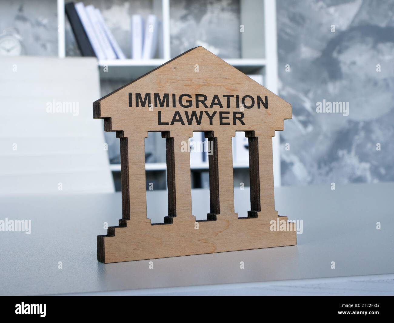 Immigration lawyer plate on the office desk. Stock Photo