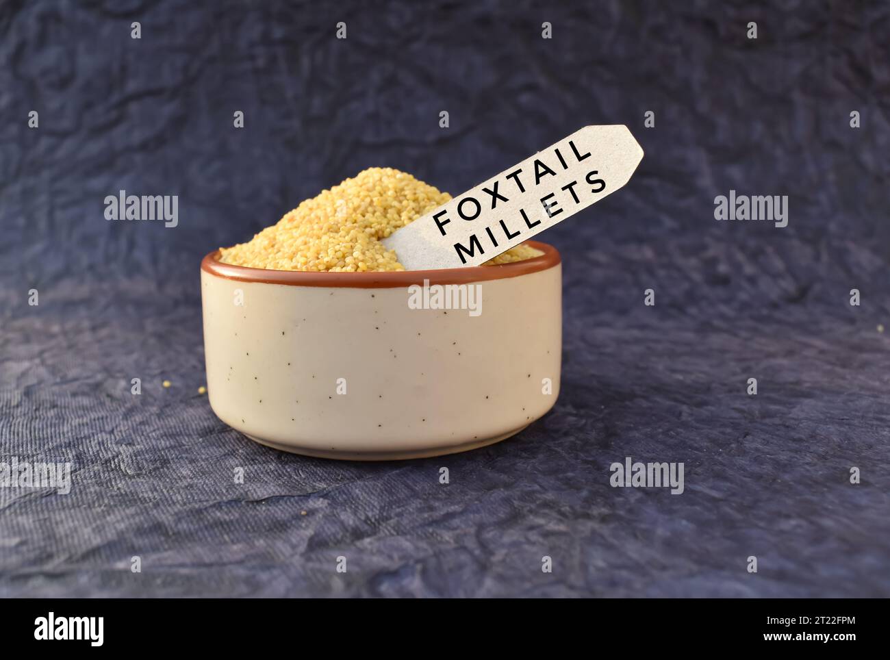 A closeup picture of a foxtail Millet grains in a bowl. Millet are