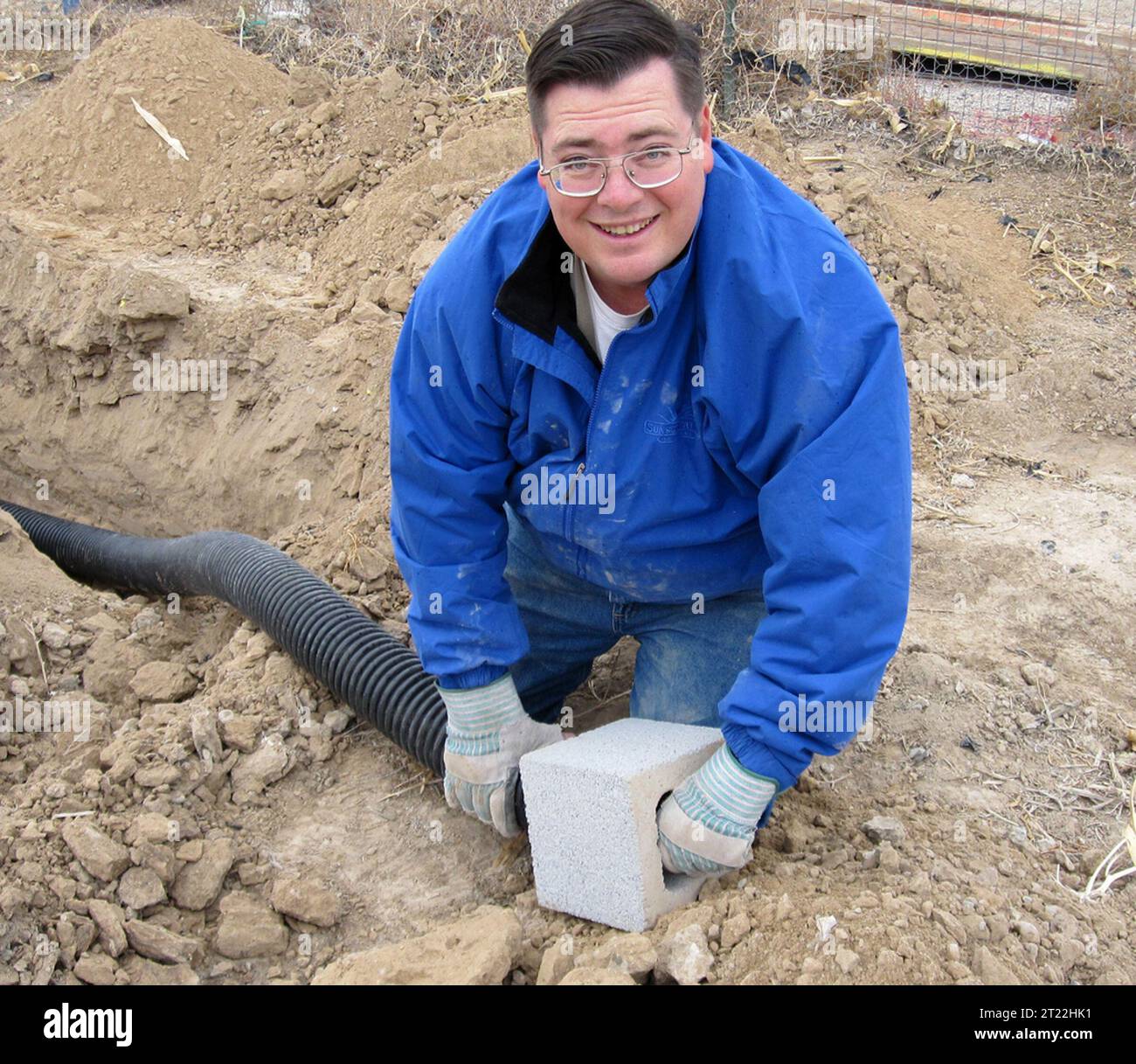 A worker helps to install artificial owl burrows in Las Vegas to
